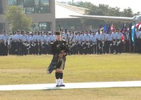 Airman 1st Class Adam Tianello, a bagpipe player with the Band of the U.S. Air Force Reserve, Robins Air Force Base, Ga., plays "Amazing Grace" during the Air Force Basic Military Training graduation parade May 27. (U.S. Air Force photo/Robbin Cresswell)