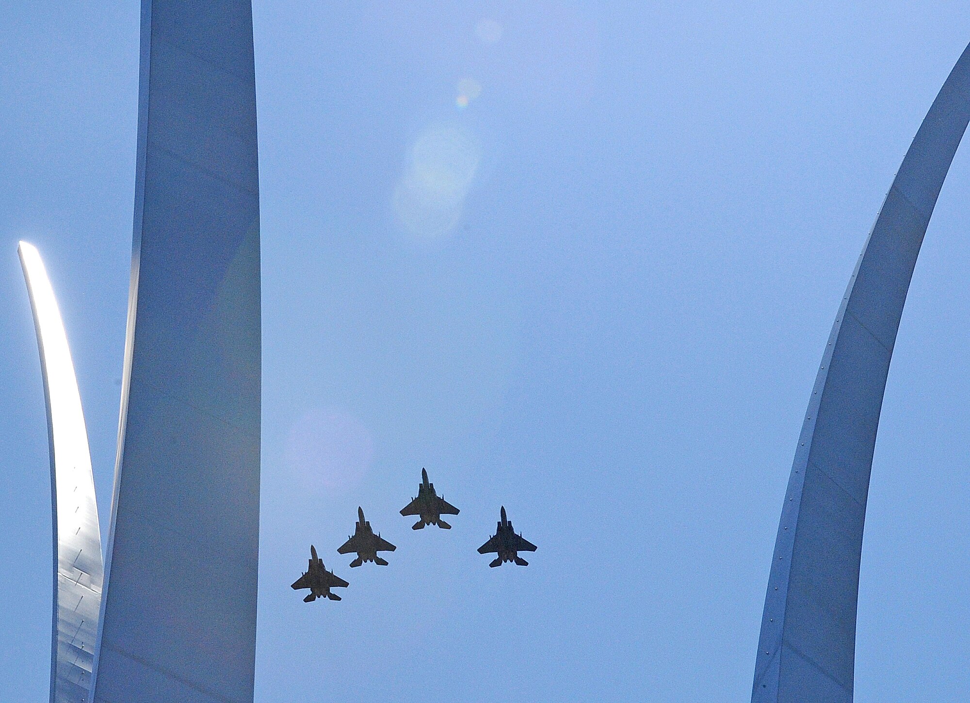 ARLINGTON, Va. -- Four F-15E Strike Eagles from Seymour Johnson Air Force Base, flyover the Air Force Memorial following the 4th Fighter Wing's acceptance of the inaugural Doolittle Award June 2, 2011. The Air Force Historical Foundation's new distinction acknowledges sustained, distinctive contributions to the history and heritage of the U.S. Air Force, and is named after aviation pioneer James H. Doolittle, who served as a lieutenant general in the United States Army Air Forces during World War II, and earned the Medal of Honor for valor and leadership as commander of the famous Doolittle Raid.(U.S. Air Force photo/Senior Airman Gino Reyes)