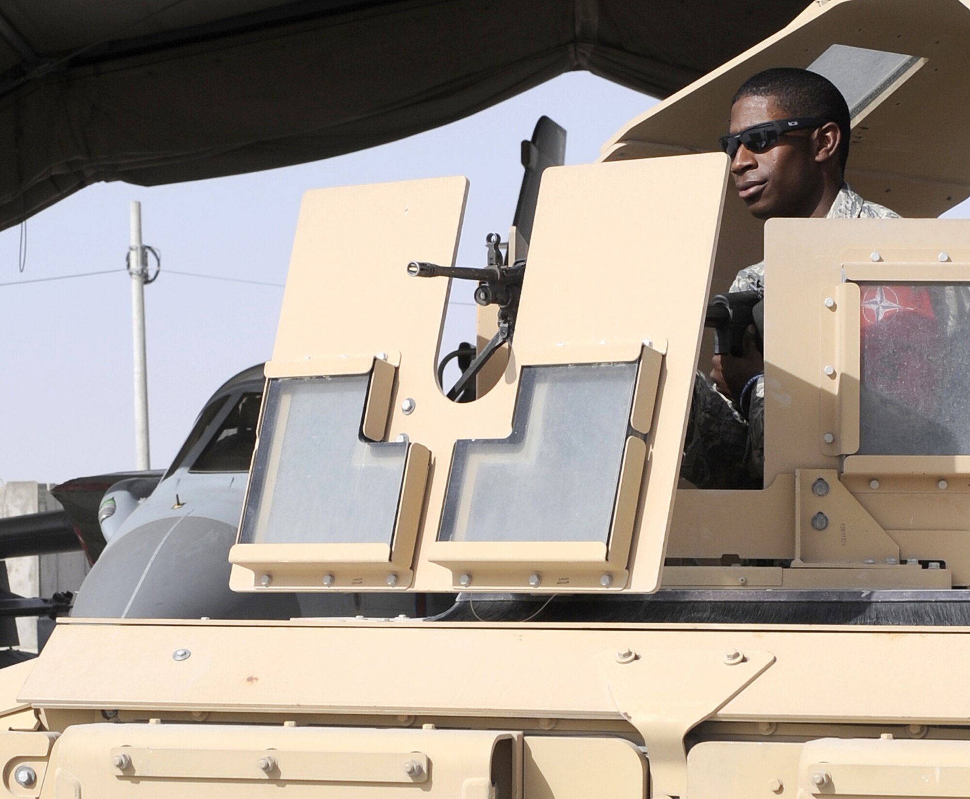 Senior Airman Kourtlyn Stafford posts security June 3, 2011, at Kandahar Airfield, Afghanistan. Airmen being assigned to a security post could be the result of a distinguished visitor, in-flight emergency, ground emergency or a number of other events calling for this mission requirement. Airman Stafford is a security forces journeyman assigned to 466th Air Expeditionary Wing Flight Line Security. (U.S. Air Force photo by Senior Airman Willard E. Grande II)