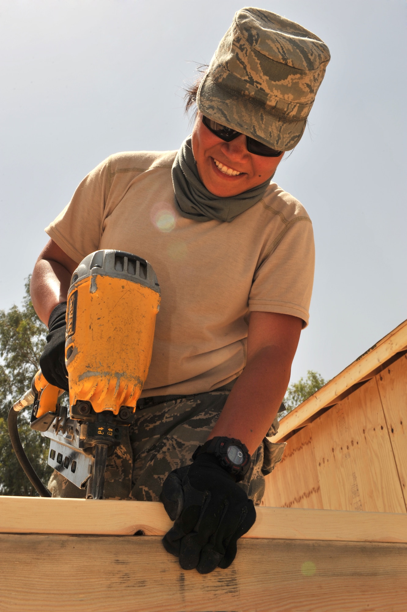 Senior Airman Ingrid Tamayo, 577th Expeditionary Prime Base Engineer Emergency Force Squadron structural journeyman, assembles rough framing of an exterior wall at a combat outpost, Afghanistan, May 23, 2011. Airman Tamayo is deployed from Travis Air Force Base, Calif., and is a native of Los Angeles. (U.S. Air Force photo by Senior Airman Sheila deVera)