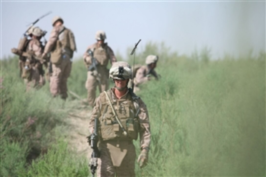 U.S. Marine Corps Sgt. Charles Hayes, with the 2nd Light Armored Reconnaissance Battalion, leads a patrol near Combat Outpost Castle, Helmand province, Afghanistan, on May 30, 2011.  The Marines patrolled the area to show continued presence and to provide security for the area.  