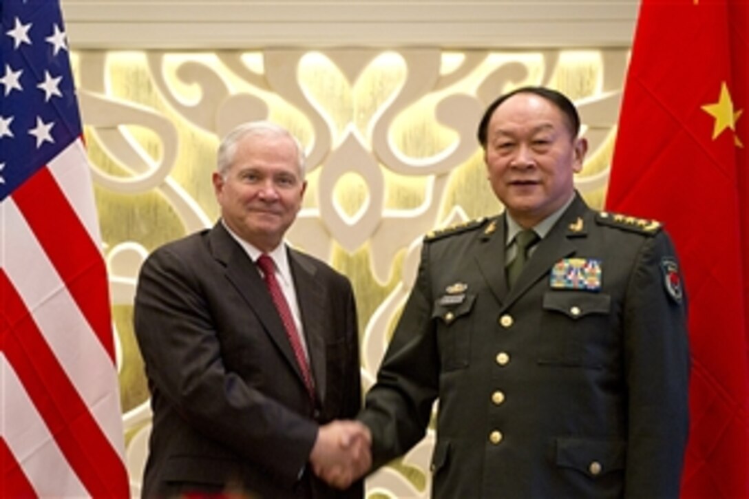 Secretary of Defense Robert M. Gates and Chinese Defense Minister Gen. Liang Guanglie shake hands before their meeting at the Shangri-La Hotel in Singapore during the 10th International Institute for Strategic Studies Asia Security Summit on June 3, 2011.  