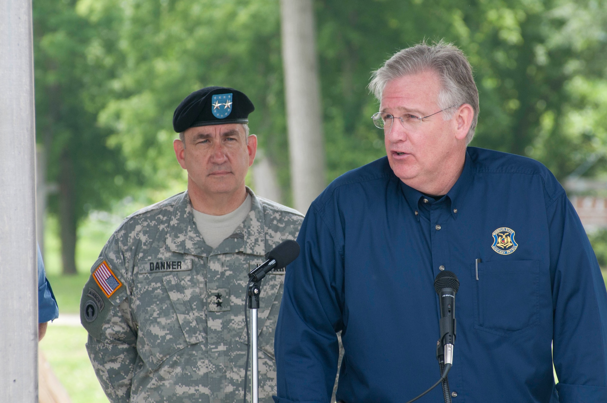 Missouri Governor Jay Nixon addresses concerns about potential flooding, as Missouri Adjutant General Stephen Danner looks on at a news conference in St. Joseph, Mo., June 2, 2011. The Missouri river is threatening to escape from its banks as citizens in the Northwest Missouri region brace for the possible flood. (U.S. Air Force photo by Master Sgt. Shannon Bond)