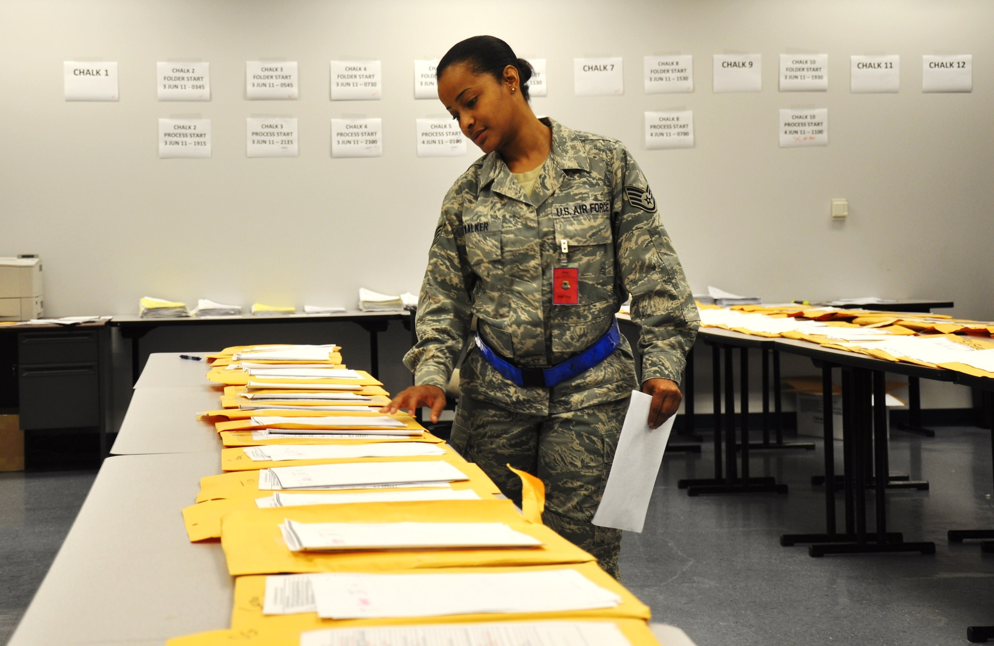 SSgt. Sgt. Natshea Walker, of the 315th Mission Support Squadron, organizes mobility file information packets for airmen in preparation for the day’s operational readiness mobility exercise on June 4, 2011 at Joint Base Charleston, S.C.
