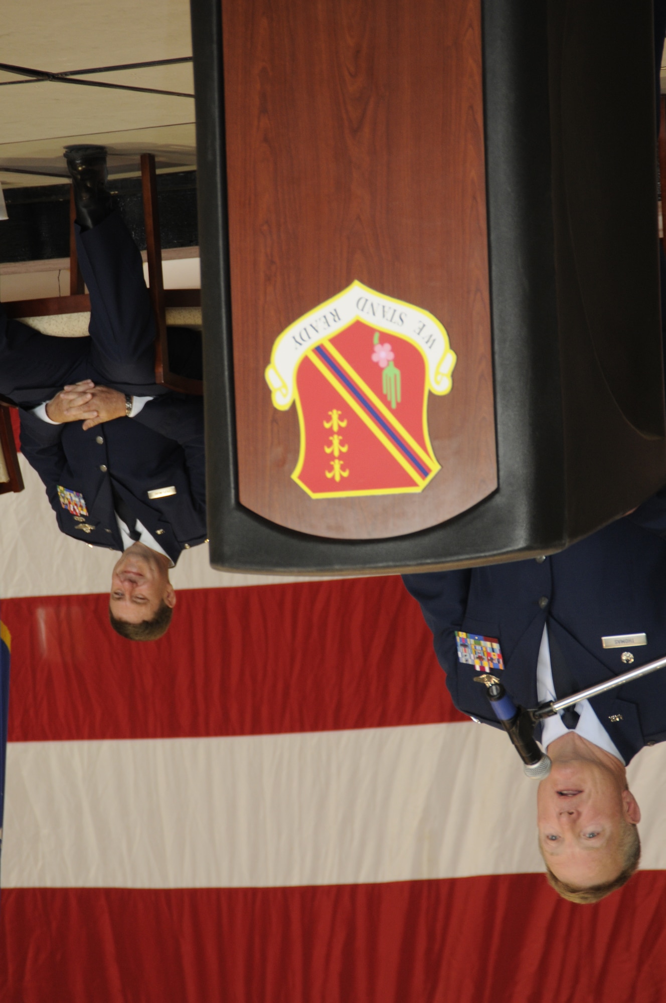Col. Michael T. Thomas addresses the 1,700 Citizen-Airmen of the 127th Wing at Selfridge Air National Guard Base, Mich., just moments after taking command of the wing. Thomas, a KC-135 pilot, replaces Brig. Gen. Michael L. Peplinski, seated, who retired after more than 32 years of military service. (U.S. Air Force photo by TSgt. David Kujawa)