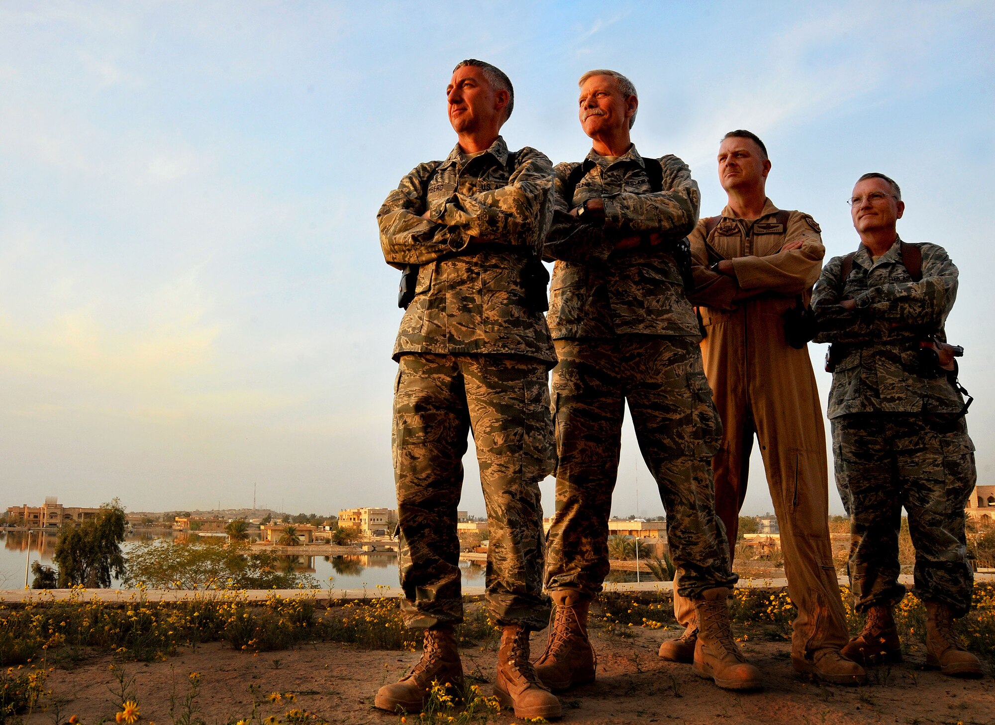 Col. Craig Bomberg, and Lt. Cols. James Hegland, Teek Dorsett, and Donald Atkinson, members of the 9th Air and Space Expeditionary Task Force-Iraq, pose for a photo in front of the Air Force House March 20, 2011, at Camp Victory, Iraq. (U.S. Air Force photo by Senior Airman Andrew Lee/Released)