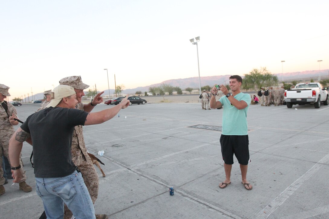 Friends of Marines and sailors with Company G., and Weapons Co., 2nd Battalion, 7th Marine Regiment, make last minute memories before departing for a seven month deployment with the 31st Marine Expeditionary Unit June 5, 2011.::r::::n::