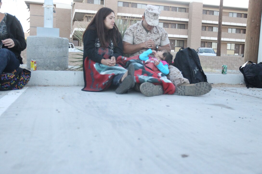 Lance Cpl. Aaron Rivera, an assistant patrol leader for Company G, 2/7, spends his last minutes playing games with his 2-year-old daughter, Scarlet, and his wife, Jerriann, before deploying to the Pacific with the 31st MEU June 5, 2011.