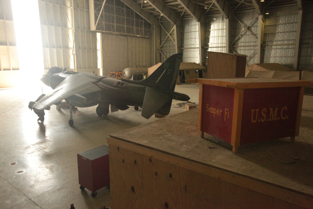 An AV-8B Harrier with Marine Attack Squadron 513 stands for maintenance in the squadron’s hangar at Kandahar Airfield, Afghanistan, June 5. Squadron maintainers ranging from ordnance technicians to airframes mechanics work 12-hour shifts to ensure the jets fly safely to fulfill their close-air support missions.