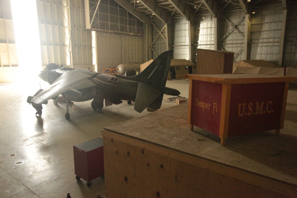 An AV-8B Harrier with Marine Attack Squadron 513 stands for maintenance in the squadron’s hangar at Kandahar Airfield, Afghanistan, June 5. Squadron maintainers ranging from ordnance technicians to airframes mechanics work 12-hour shifts to ensure the jets fly safely to fulfill their close-air support missions.