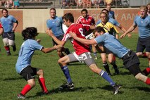 A member of the Western Alliance Rugby Club runs past several St. Cloud Steelheads during the Boys Division 2 championship match of the Minnesota Amateur Rugby Foundation Tournament at Gordy Aamoth Jr., Memorial Stadium June 5. The Steelheads beat WAR for the state title. For additional imagery from the event, visit www.facebook.com/rstwincities.