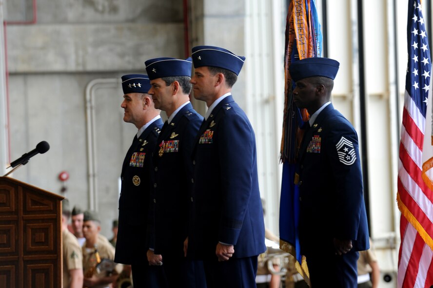 (From left to right) Lt. Gen. Burton Field, Brig. Gen. Ken Wilsbach, Brig. Gen. Matt Molloy and Chief Master Sgt. James Davis stand at attention during the singing of the American and Japanese national anthems at the 18th Wing change of command ceremony at Kadena Air Base, Japan, June 3. During the ceremony, Brig. Gen. Ken Wilsbach relinquished command of the wing to Brig. Gen. Matt Molloy. General Field is the United States Forces, Japan and 5th Air Force commander and Chief Davis is the 18th Wing command chief master sergeant. (U.S. Air Force photo/Junko Kinjo)