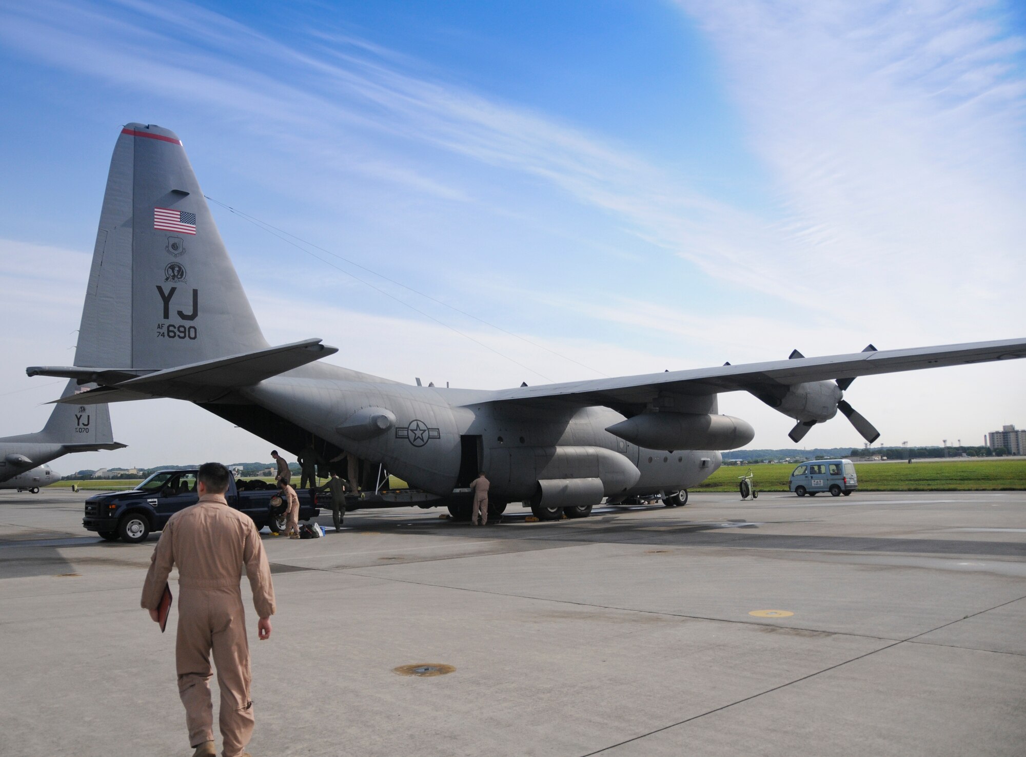 YOKOTA AIR BASE, Japan -- Members of the 36th Airlift Squadron prepare to depart for a deployment from Yokota, June 3, 2011. Wing leadership, friends and family members came out to show support to the members of the 36th AS as they depart on a deployment to Southwest Asia. (U.S. Air Force photo/Airman John D. Partlow)