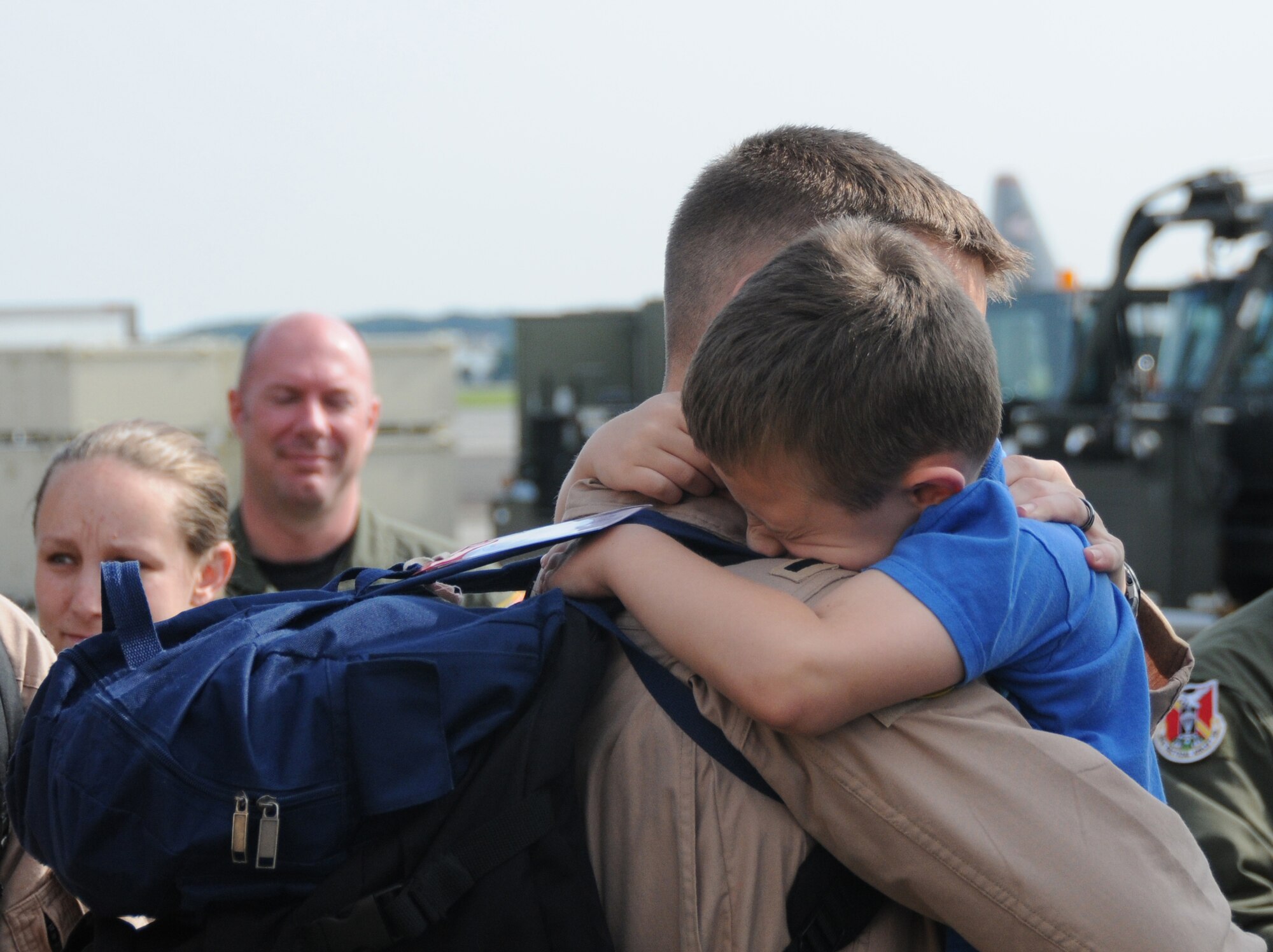YOKOTA AIR BASE, Japan -- 1st Lt. Jeffrey Copeland, 36th Airlift Squadron C-130 Hercules co-pilot, says goodbye to his son before deploying from Yokota, June 3, 2011. Wing leadership, friends and family members came out to show their support for members of the 36th AS as they depart on a deployment to Southwest Asia. (U.S. Air Force photo/Airman John D. Partlow)