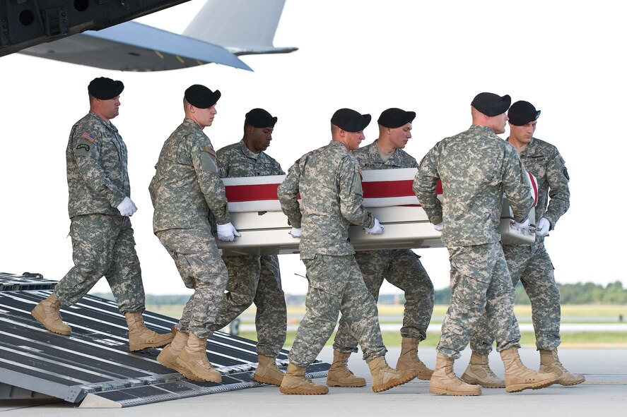 A U.S. Army carry team transfers the remains of Army Sgt. Jeffrey C. S. Sherer, of Four Oaks, N.C., at Dover Air Force Base, Del., June 5, 2011. Sherer was assigned to the 1st Battalion, 24th Infantry Regiment, 1st Brigade Combat Team, 25th Infantry Division, Fort Wainwright, Alaska. (U.S. Air Force photo/Roland Balik)