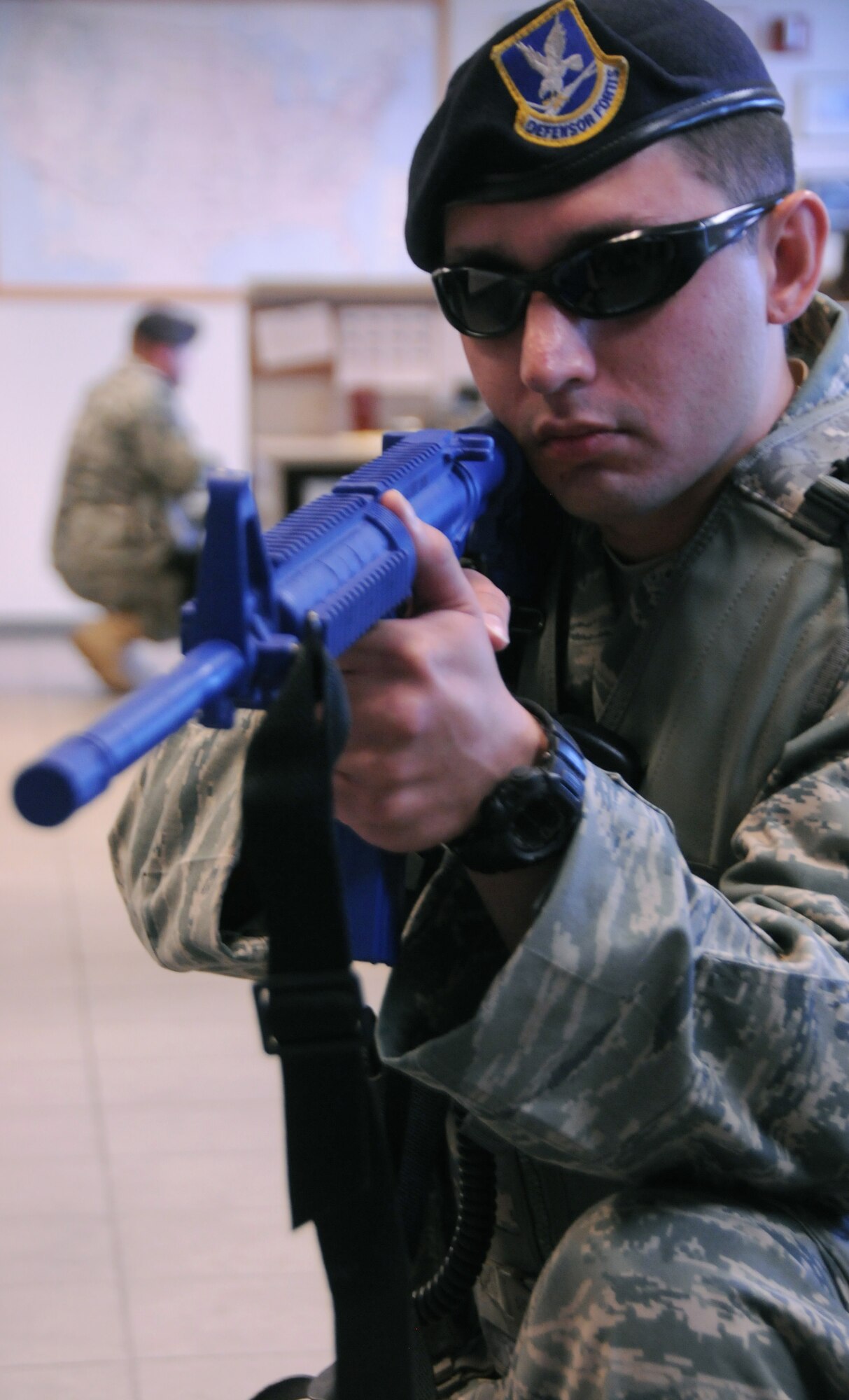 U.S. Air Force Senior Airman Joshua Ridgley, 161st Security Forces Squadron member, breaches a building as part of a simulated active shooter exercise at the 161st Air Refueling Guard base, Phoenix, June 4, 2011. This exercise brings together members of the Air National Guard, the Phoenix Police Department, the Federal Aviation Administration and the Transportation Security Agency in order to improve interagency communication. (U.S. Air Force photo by Staff Sgt. Courtney Enos/Released)
 
