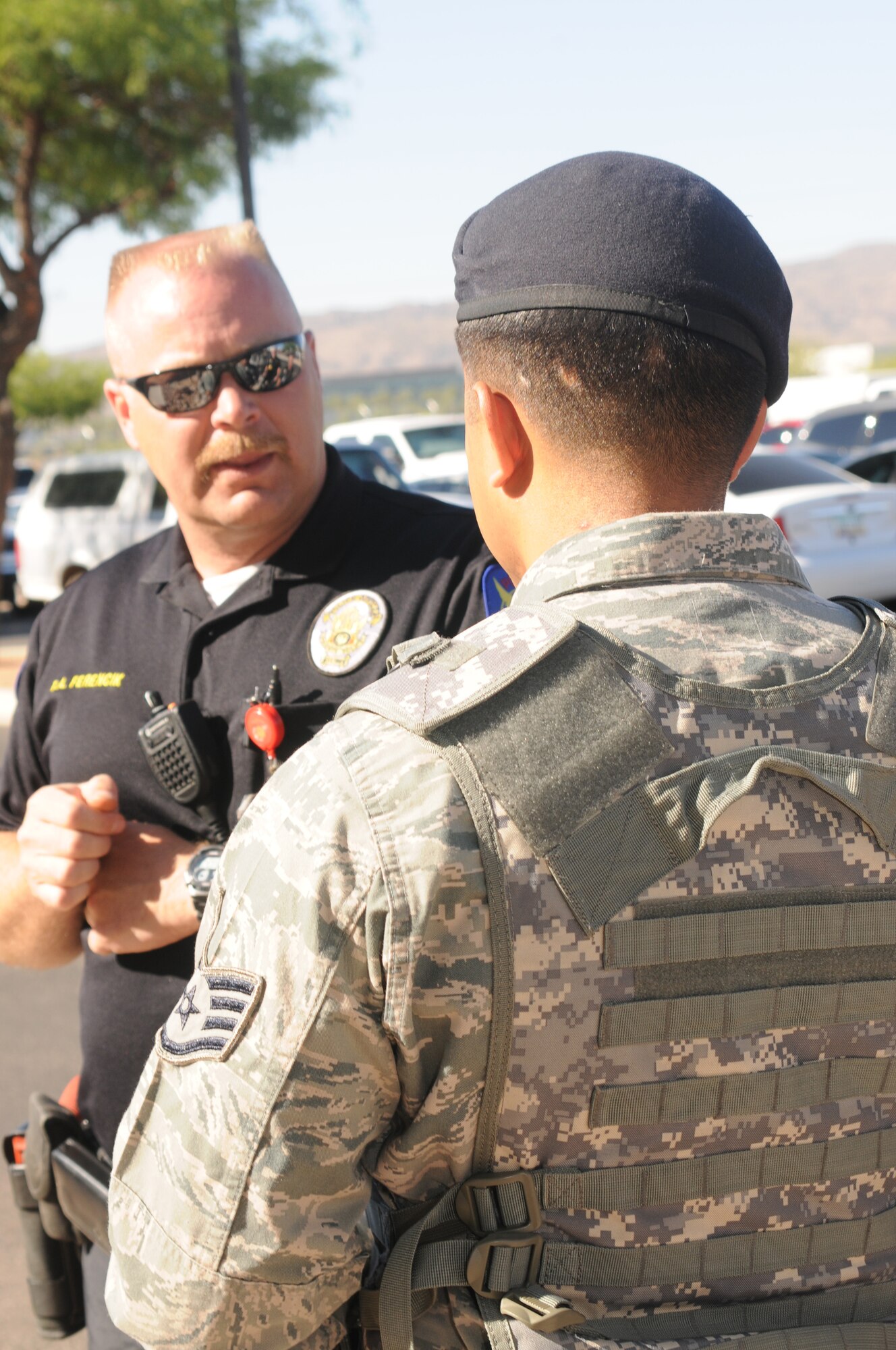 U.S. Air Force Staff Sgt Brandon Gabrielle and Phoenix Police Department Troy Ferencik during an active shooter exercise at the 161st Air Refueling Wing in Phoenix Ariz. on June 4 , 2011. The exercise allowed joint forces to work together in case of an emergency situation. (U.S. Air Force photo by A1C Rashaunda Williams/Released)