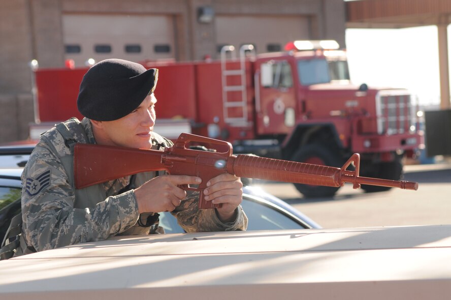 Staff Sgt Anthony Keaton stands on guard during an active shooter exercise at the 161st Air Refueling Wing in Phoenix Ariz. on June 4, 2011.  The exercise allowed joint forces to work together in case of an emergency situation. (U.S. Air Force photo by A1C Rashaunda Williams/Released)





