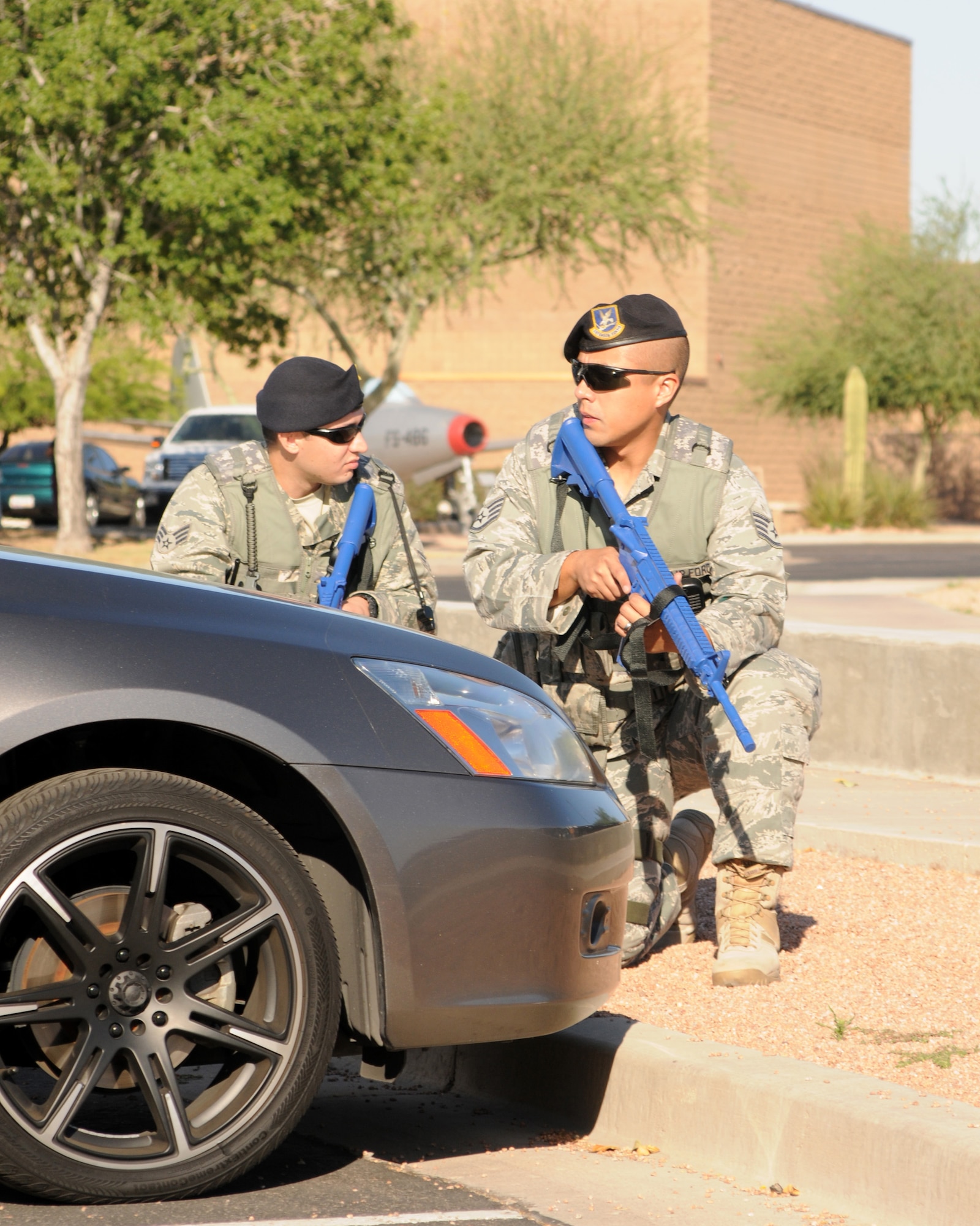 Us. Air Force Staff Sgt Brandon Gabriel        and SrA Joshua Ridgey during an active shooter exercise at the 161st Air Refueling Wing in Phoenix Ariz. on June 4, 2011.  The exercise allowed joint forces to work together in case of an emergency situation. (U.S. Air Force photo by A1C Rashaunda Williams/Released)



