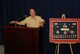 Mark E. Brown, retired Lieutenant Colonel, speaks to the crowd of his retirement ceremony, held June 4th, 2011, after being presented with a career shadow box.