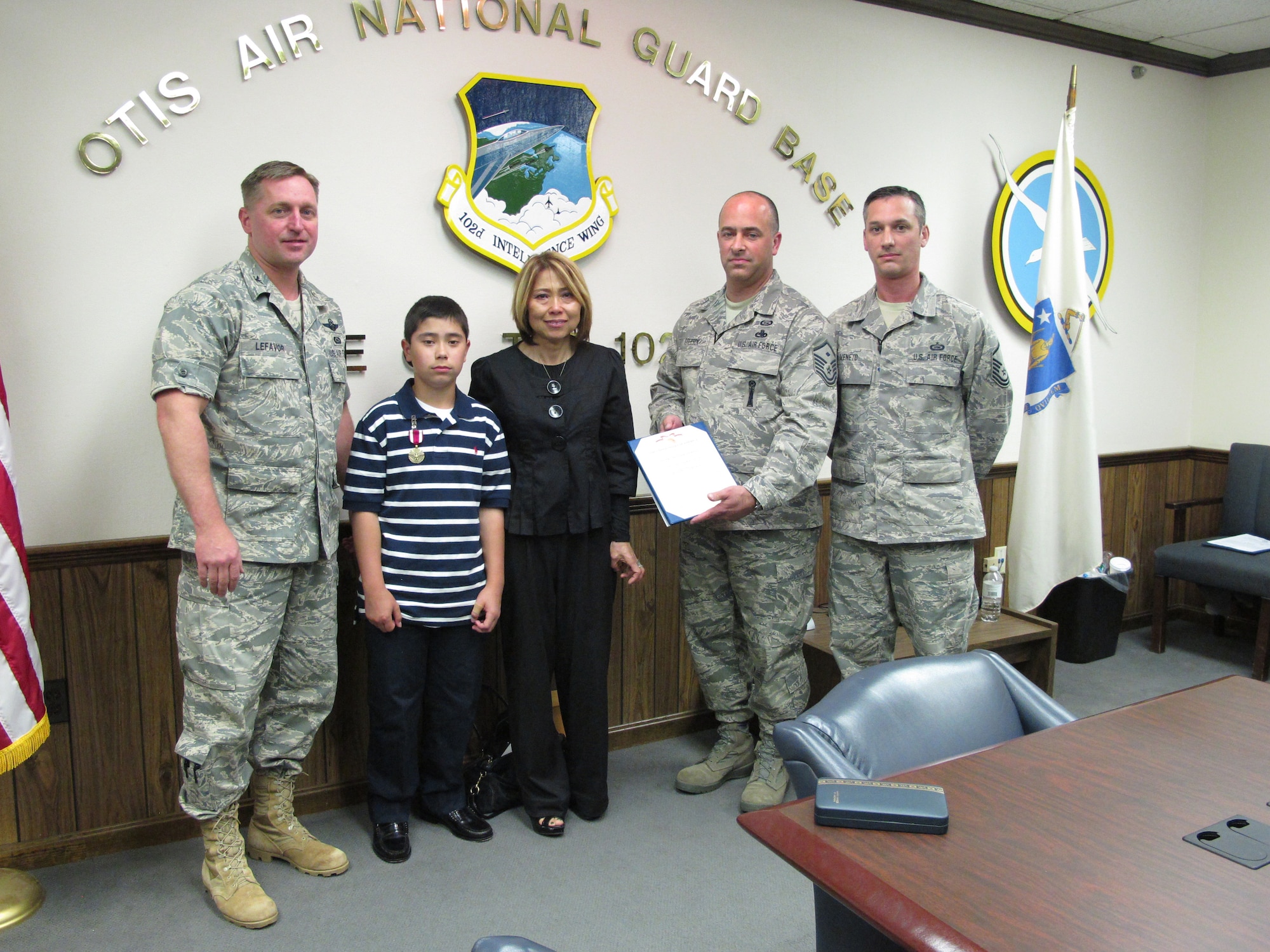 A posthumous Meritorious Service Medal was presented to the family of Tech. Sgt. Robert Seaver on June 5, 2011. Tech. Sgt. Seaver’s wife, Fusako and their son, Takuya “TK” were presented with the medal after Master Sgt. Edward Veneto of the 101st Intelligence Squadron read the order. 

Tech. Sgt. Seaver suddenly passed away on Feb. 17, 2011 at Beth Israel at the age of 39. He was the devoted father of Takuya of Plymouth and the son of Pamela Seaver of Melbourne, Fla., and the late Kenneth L. Seaver. Bob made a name for himself in short order by graduating from Special Signals Intelligence School with honors and then quickly certifying in his weapons system position. He was a 19-year military veteran with vast experience across both the Navy and the Air Force.

Pictured from left to right: Col. James LeFavor, Takuya Seaver, Mrs. Fusako Seaver, Master Sgt. Kevin Greeson, and Master Sgt. Edward Veneto. (U.S. Air Force photo by Tech. Sgt. Kerri Cole)
