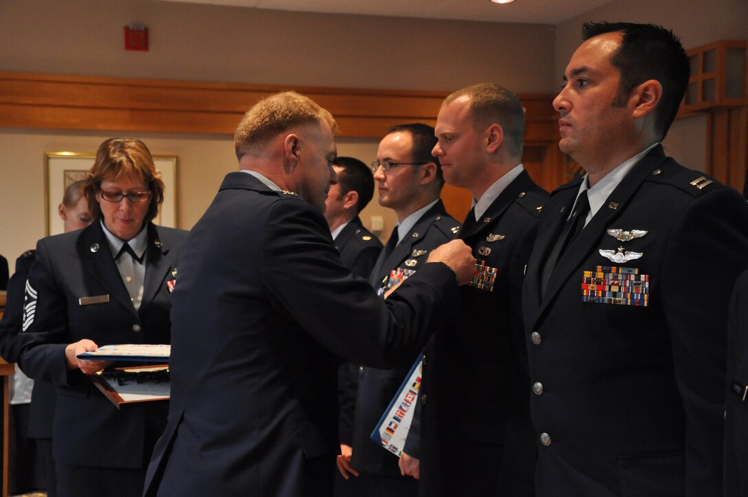 Col Ron Wilt operations group commander, presents awards during commanders call . Minneapolis ARS , MN.(Air Force Photo/TSgt Bob Sommer)