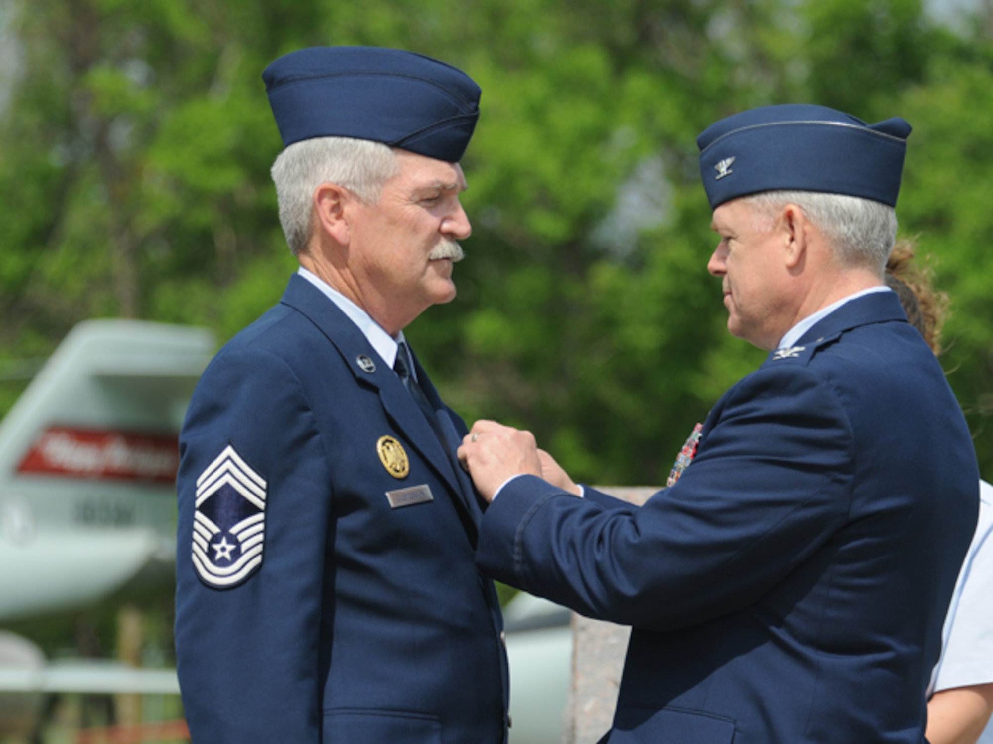 Col. Michael Wobbema, the North Dakota National Guard director of joint staff and assistant adjutant general for air, pins the Defense Meritorious Service Medal onto the jacket of Chief Master Sgt. James Clemenson, left, June 4, during Clemenson's retirement ceremony at the North Dakota Air National Guard, Fargo, N.D. Clemenson is the last enlisted Airman to have been stationed in Vietnam to retire from the Air Force.  Clemenson did two tours in Vietnam with the U.S. Army from October 1970 through April 1972. He joined the North Dakota Air National Guard in 1973 and has most recently served as the National Guard Bureau senior enlisted manager for the joint staff, Washington, D.C. He has served in the United States military for 41 years. Only one other active Airman, Chief Master Sgt. Jim Honeycutt, still remains in service that wears a Vietnam Service Ribbon, although it's for temporary duty in country versus a mobilization. Clemenson and Honeycutt's status is among active-duty Airmen and does not include drill status Guardsmen, on which no clear statistics were available.

