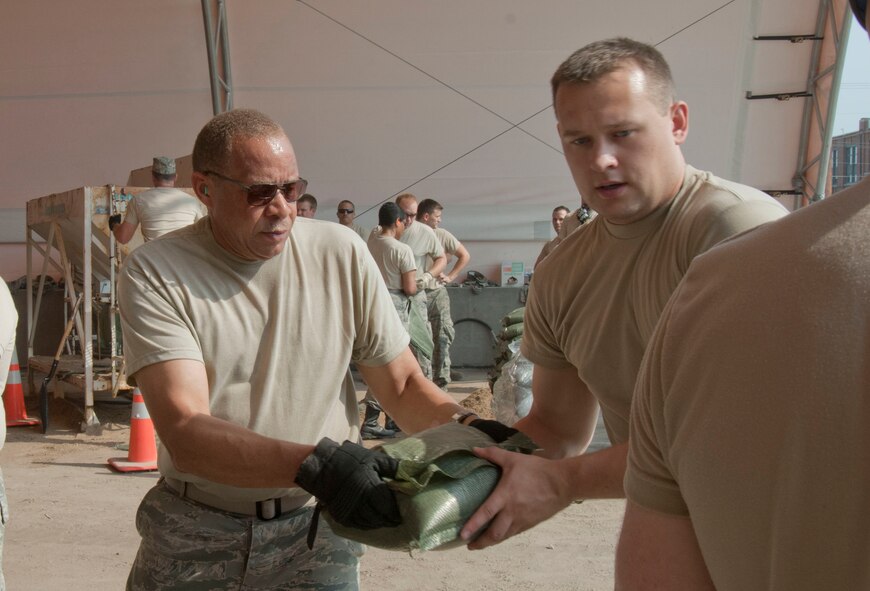 Members of the 139th Airlift Wing, Missouri Air National Guard, fill sandbags during Operation Show Me Northern Tide, June 4, 2011. (U.S. Air Force Photo by Airman 1st Class Kelsey L. Stuart/Released)