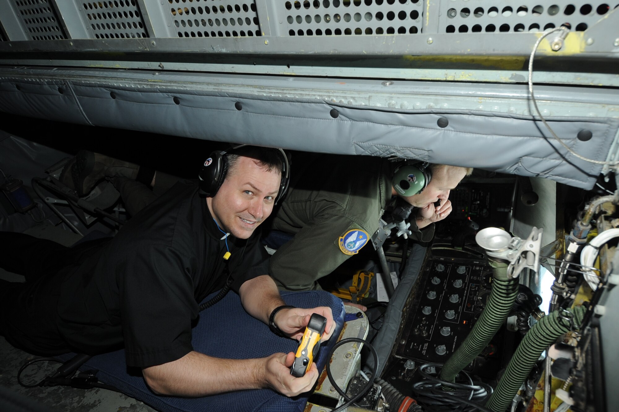 Fr. Yancey Burgess of St. Elizabeth Ann Seton Catholic Church in Wichita, KS observes as the boom is lowered to refuel a B-52 Stratofortress. (Air Force photo by Tech. Sgt. Brannen Parrish)