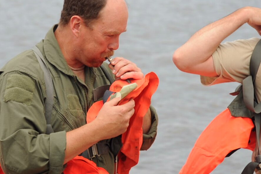 Members of the 180th Airlift Squadron, 139th Airlift Wing, Missouri Air National Guard, participate in survival training in Northern Missouri June 4, 2011. (U.S. Air Force photo by Senior Airman Sheldon Thompson/RELEASED)