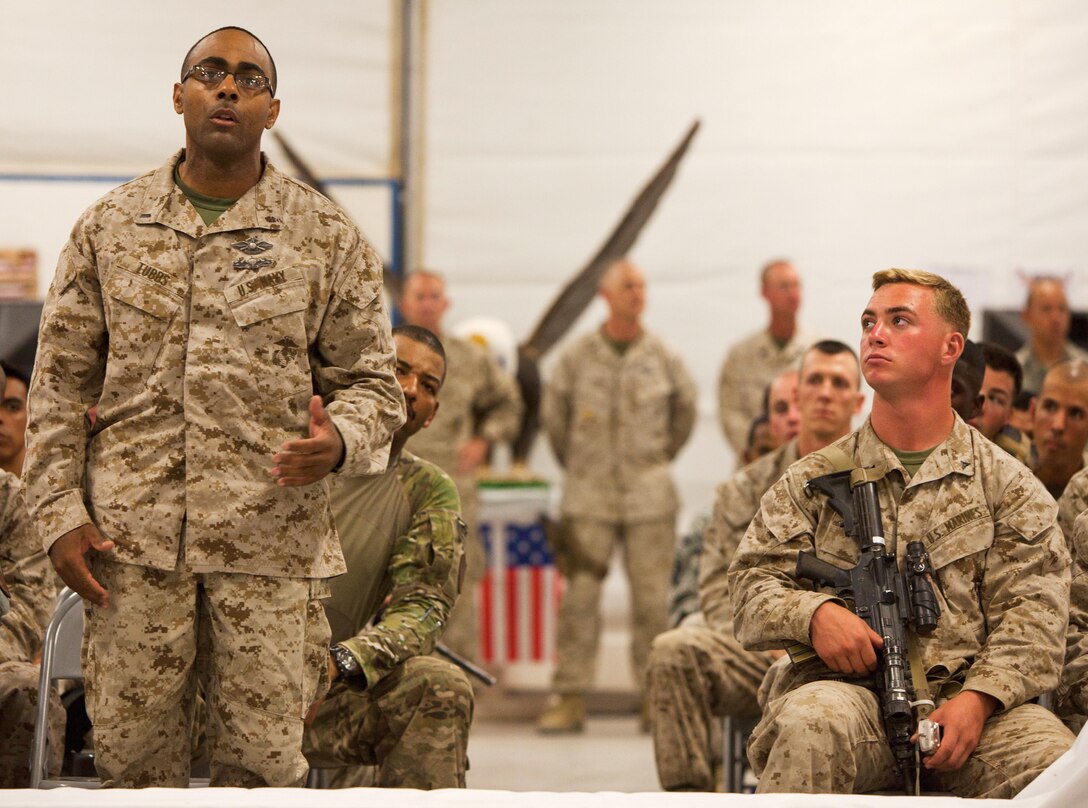 A service member here addresses a question to U.S. Secretary of Defense Robert Gates, June 5. Gates stopped at Dwyer during his farewell tour of Afghanistan. He is slated to step down from his post this month.
