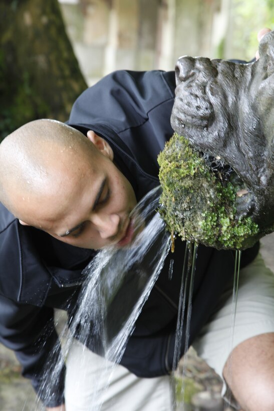 Sgt. Anthony Fortunato Jr., a crew chief with Marine Medium Tiltrotor Squadron 365, drinks from the moss covered “Devil Dog” fountain in the village of Belleau, France, June 7. Marines took the village of Belleau from the Germans in World War I. The area was then called Bois de Belleau, but was renamed to Bois de la Brigade de Marine to commemorate the Marines of 4th Brigade who stopped the Germans from entering Paris.
