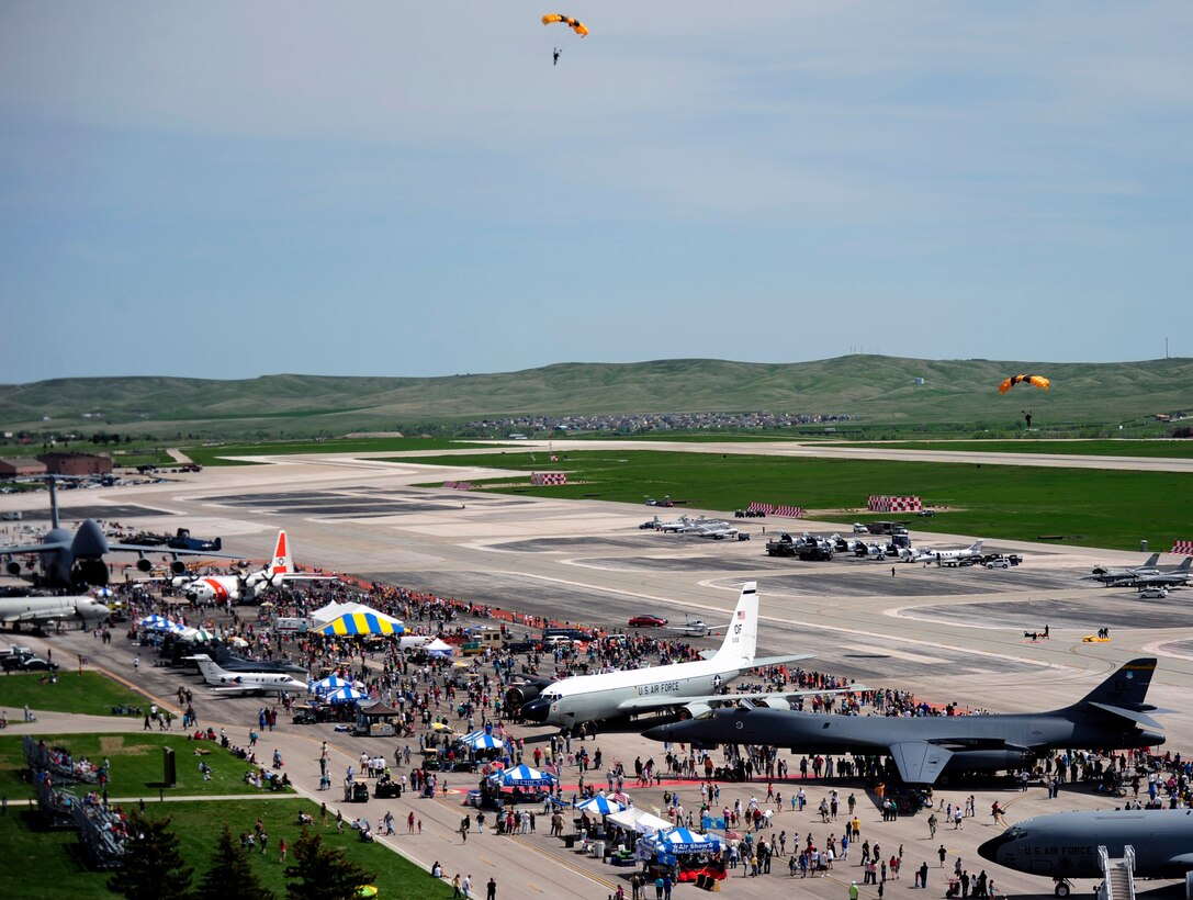 Members of the U.S. Army Golden Knights Parachute Team descend over the 2011 Dakota Thunder airshow at Ellsworth Air Force Base, S.D., June 4, 2011. The Golden Knights have consistently performed well at international parachuting competitions. (U.S. Air Force photo/Staff Sgt. Marc I. Lane)