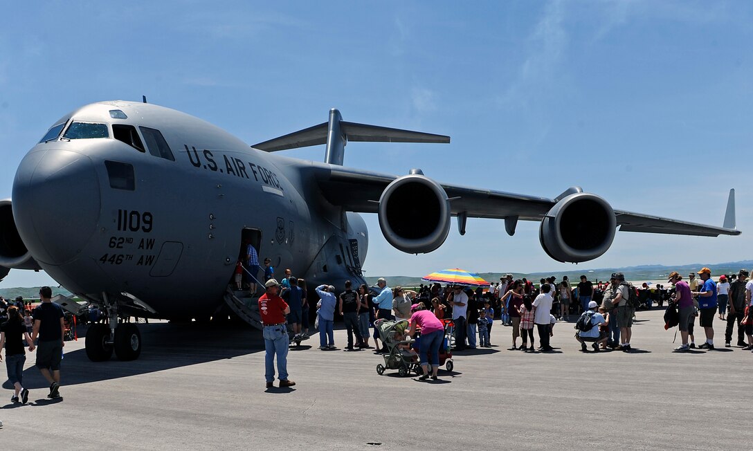 The crew of a C-17 Globemaster III gives tours of the aircraft during the 2011 Dakota Thunder airshow at Ellsworth Air Force Base, S.D., June 4, 2011.  The primary function of the C-17 is to transport cargo and personnel. (U.S. Air Force photo/Staff Sgt. Marc I. Lane)