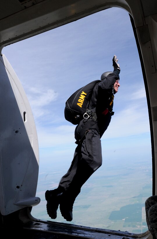 A member of the U.S. Army Golden Knights Parachute Team takes to the air during the 2011 Dakota Thunder airshow at Ellsworth Air Force Base, S.D., June 4, 2011. The Golden Knights have consistently performed well at international parachuting competitions. (U.S. Air Force photo/Senior Airman Adam Grant)