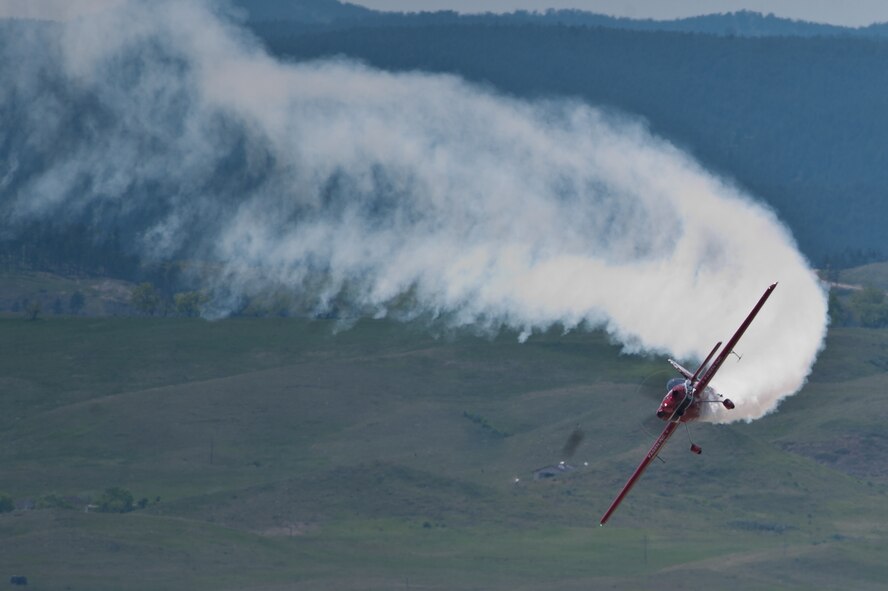 Greg Poe performs in his Fagen MX2 during the 2011 Dakota Thunder airshow at Ellsworth Air Force Base, S.D., June 4, 2011. Nearly 40,000 people of all ages and walks of life converged here to watch the vast array of aerial demonstrations and view numerous static aircraft.  (U.S. Air Force photo illustration/Tech. Sgt. Nathan Gallahan)