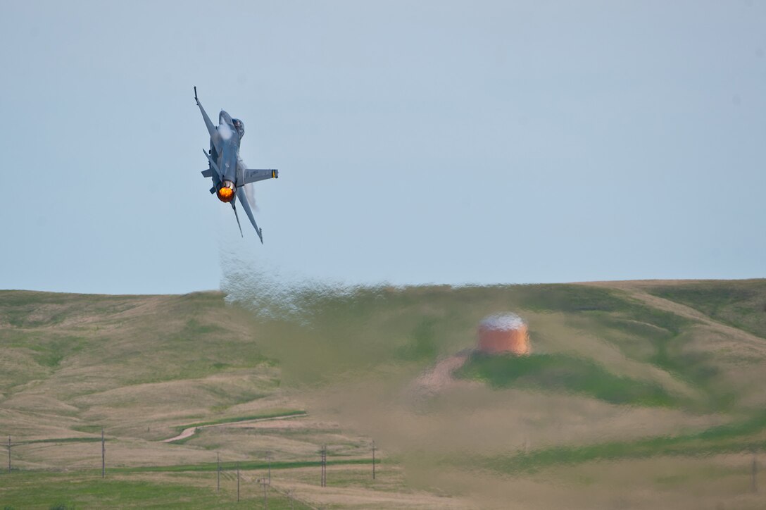 An F-16 Fighting Falcon from the Air Combat Command Viper West Demonstration Team performs during the 2011 Dakota Thunder airshow at Ellsworth Air Force Base, S.D., June 4, 2011. Nearly 40,000 people of all ages and walks of life converged here to watch the vast array of aerial demonstrations and view numerous static aircraft. (U.S. Air Force photo/Tech. Sgt. Nathan Gallahan)
