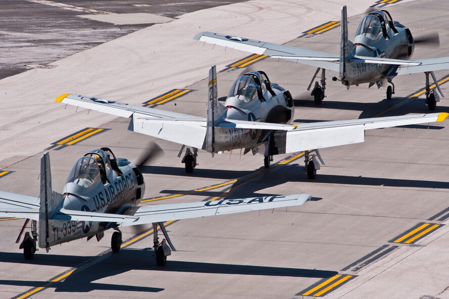 The Trojan Horsemen file past the crowd on their way to perform during the 2011 Dakota Thunder airshow at Ellsworth Air Force Base, S.D., June 4, 2011. Nearly 40,000 people of all ages and walks of life converged here to watch the vast array of aerial demonstrations and view numerous static aircraft. (U.S. Air Force photo/Tech. Sgt. Nathan Gallahan)