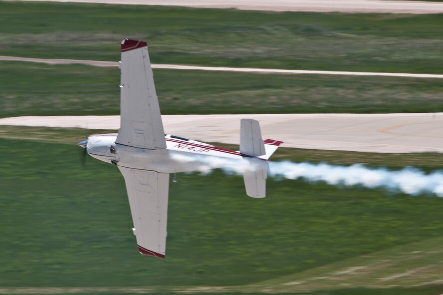 Jim Peitz performs in his F33C Bonanza during the 2011 Dakota Thunder airshow at Ellsworth Air Force Base, S.D., June 4, 2011. Nearly 40,000 people of all ages and walks of life converged here to watch the vast array of aerial demonstrations and view numerous static aircraft. (U.S. Air Force photo/Tech. Sgt. Nathan Gallahan)