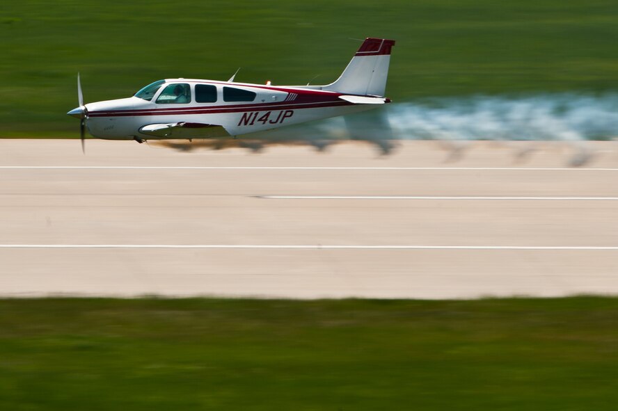 Jim Peitz performs in his F33C Bonanza during the 2011 Dakota Thunder airshow at Ellsworth Air Force Base, S.D., June 4, 2011. Nearly 40,000 people of all ages and walks of life converged here to watch the vast array of aerial demonstrations and view numerous static aircraft. (U.S. Air Force photo/Tech. Sgt. Nathan Gallahan)
