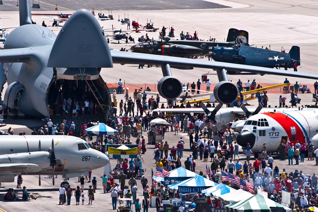 Attendees of the 2011 Dakota Thunder airshow meander amongst static displays at Ellsworth Air Force Base, S.D., June 4, 2011. Nearly 40,000 people of all ages and walks of life converged here to watch the vast array of aerial demonstrations and view numerous static aircraft. (U.S. Air Force photo/Tech. Sgt. Nathan Gallahan)