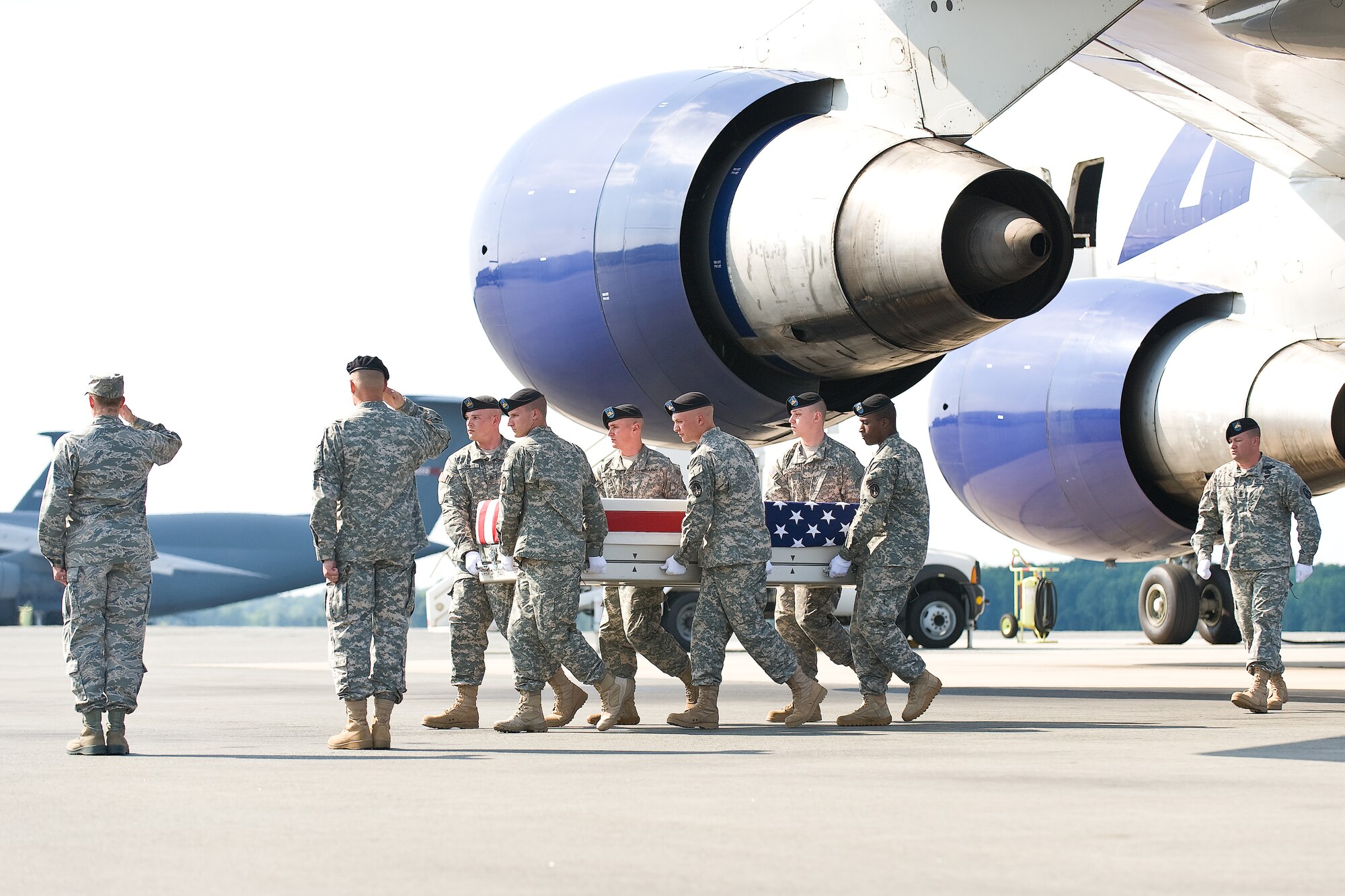 A U.S. Army carry team transfers the remains of Army Pfc. Robert L. Voakes Jr., of L'Anse, Mich., at Dover Air Force Base, Del., June 6, 2011. Voakes was assigned to the 164th Military Police Company, Fort Wainwright, Alaska. (U.S. Air Force photo/Roland Balik)