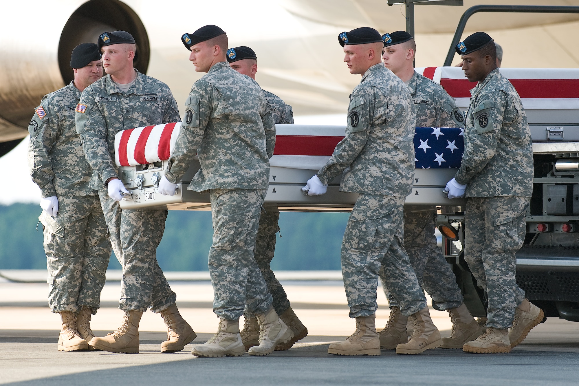 A U.S. Army carry team transfers the remains of Army Spc. Devin A. Snyder, of Cohocton, N.Y., at Dover Air Force Base, Del., June 6, 2011. Snyder was assigned to the 164th Military Police Company, Fort Wainwright, Alaska. (U.S. Air Force photo/Roland Balik)