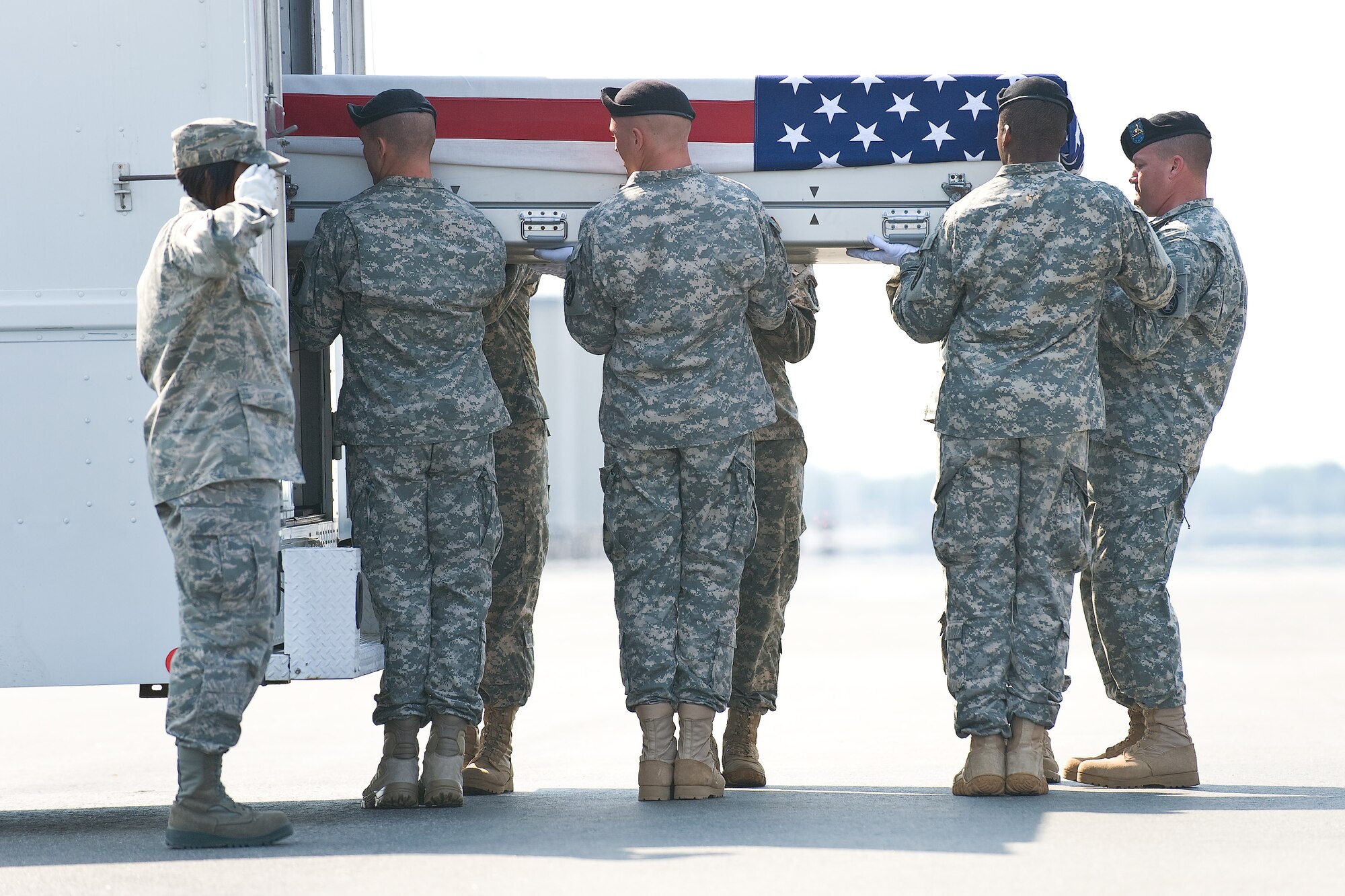 A U.S. Army carry team transfers the remains of Army Cpl. Christopher R. Bell, of Golden, Miss., at Dover Air Force Base, Del., June 6, 2011. Bell was assigned to the 164th Military Police Company, Fort Wainwright, Alaska. (U.S. Air Force photo/Roland Balik)