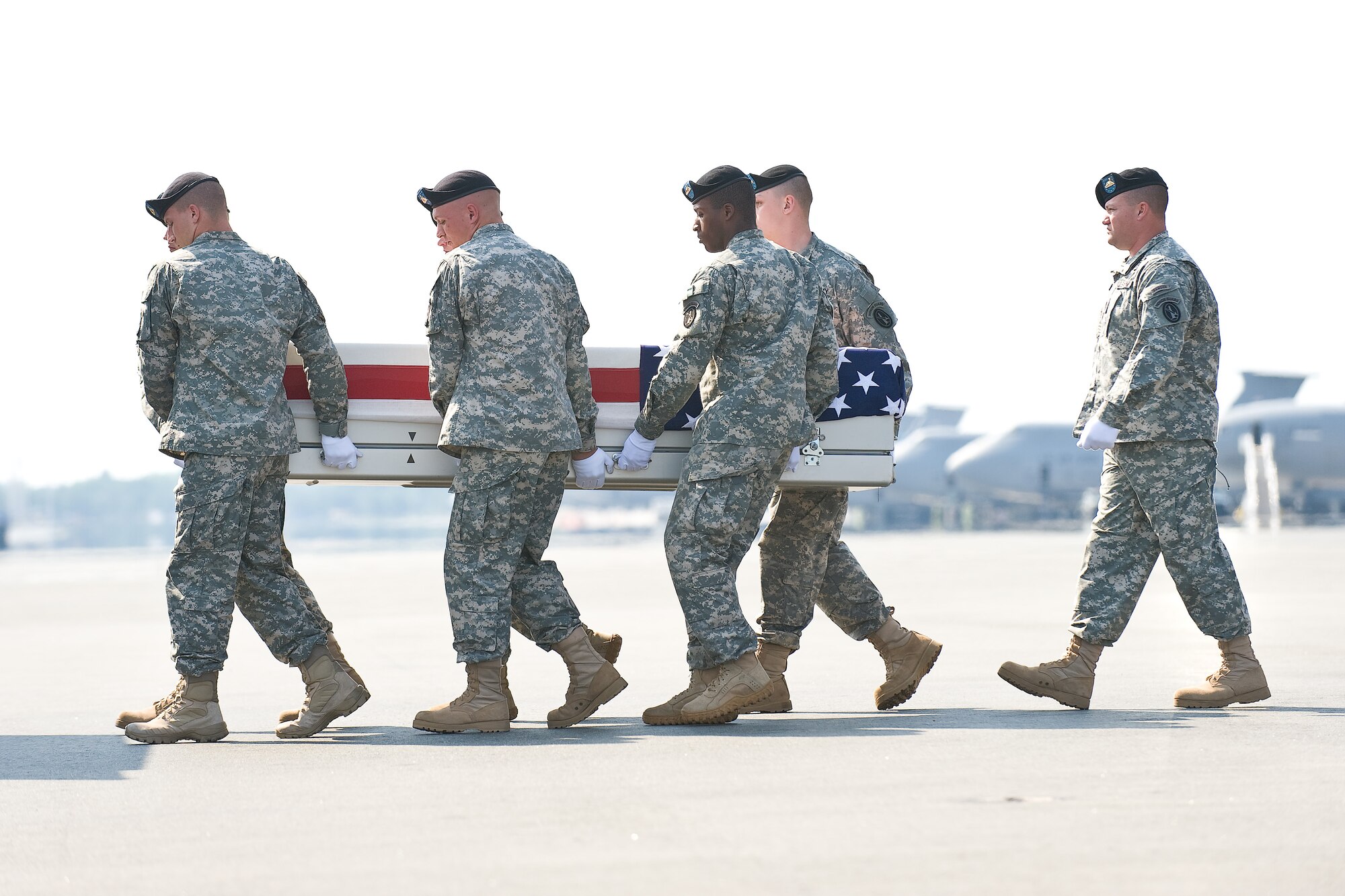 A U.S. Army carry team transfers the remains of Army Sgt. Joshua D. Powell, of Quitman, Texas, at Dover Air Force Base, Del., June 6, 2011. Powell was assigned to the 164th Military Police Company, Fort Wainwright, Alaska. (U.S. Air Force photo/Roland Balik)