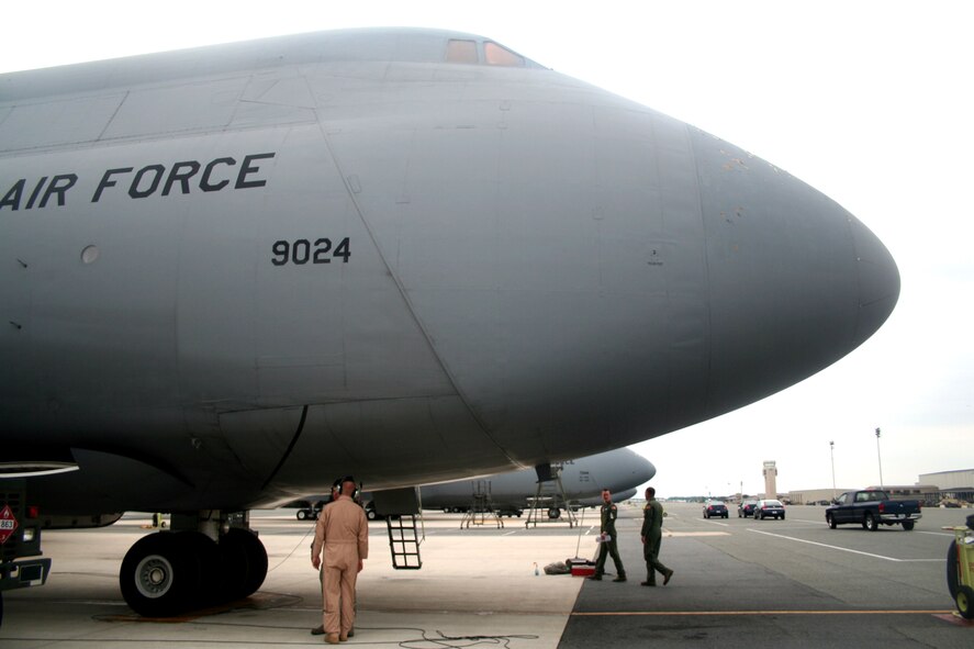 Maintenance crew chiefs from the 436th Aircraft Maintenance Squadron and aircrew Airmen from the 9th Airlift Squadron prepare a C-5M Super Galaxy for a mission at Dover Air Force Base, Del., on June 5, 2011. The C-5Ms mission was to complete the first Arctic overflight from Dover AFB to Bagram Airfield, Afghanistan. The plane successfully landed at Bagram just over 15 hours later on June 6, 2011. (U.S. Air Force Photo/Master Sgt. Scott T. Sturkol)