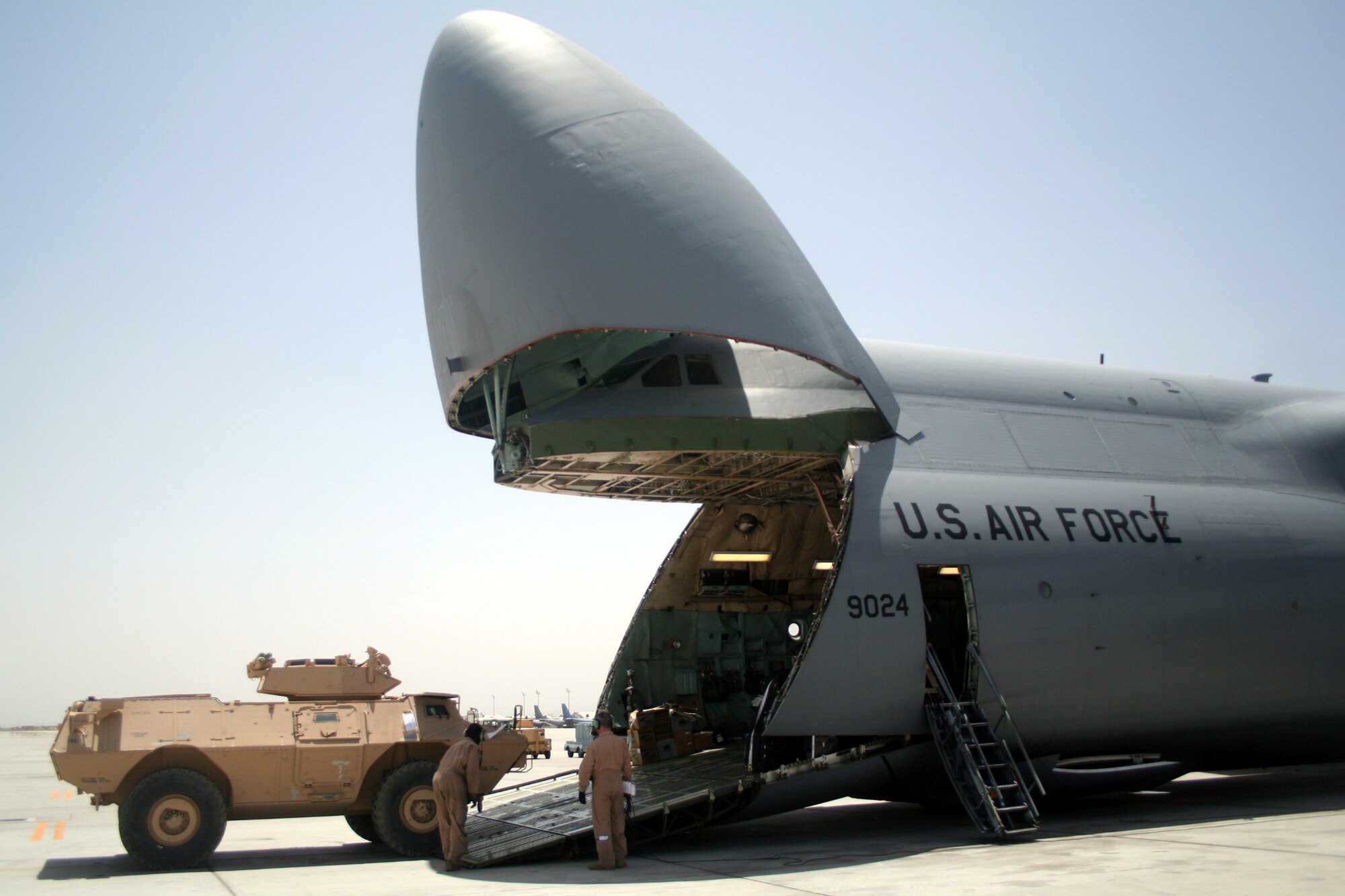 Airmen load a C-5M Super Galaxy from Dover Air Force Base, Del., with cargo at Bagram Airfield, Afghanistan, on June 5, 2011. The C-5M's mission to Bagram  was to complete the first Arctic overflight from Dover AFB to Bagram Airfield. The plane successfully landed at Bagram in just over 15 hours on June 6, 2011. (U.S. Air Force Photo/Master Sgt. Scott T. Sturkol)