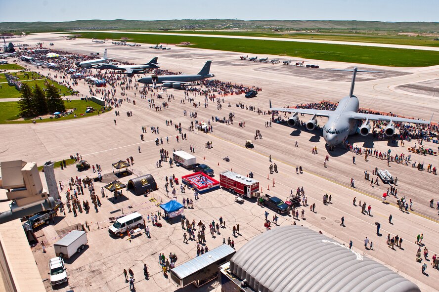 Attendees of the 2011 Dakota Thunder airshow meander amongst static displays at Ellsworth Air Force Base, S.D., June 4, 2011. Nearly 40,000 people of all ages and walks of life converged here to watch the vast array of aerial demonstrations and view numerous static aircraft. (U.S. Air Force photo/Tech. Sgt. Nathan Gallahan)
