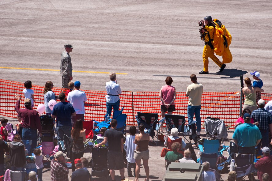 A U.S. Army Golden Knight waves to the 2011 Dakota Thunder airshow crowd after his performance at Ellsworth Air Force Base, S.D., June 4, 2011. Nearly 40,000 people of all ages and walks of life converged here to watch the vast array of aerial demonstrations and view numerous static aircraft. (U.S. Air Force photo/Tech. Sgt. Nathan Gallahan)