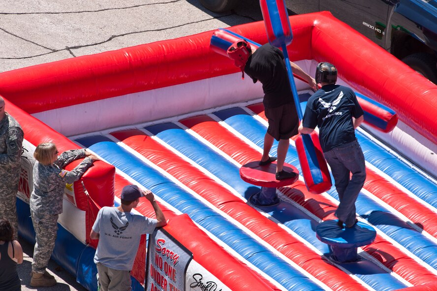 Two Dakota Thunder 2011 attendees square off in the jousting booth at Ellsworth Air Force Base, S.D., June 4, 2011. Nearly 40,000 people of all ages and walks of life converged here to watch the vast array of aerial demonstrations and view numerous static aircraft. (U.S. Air Force photo/Tech. Sgt. Nathan Gallahan)